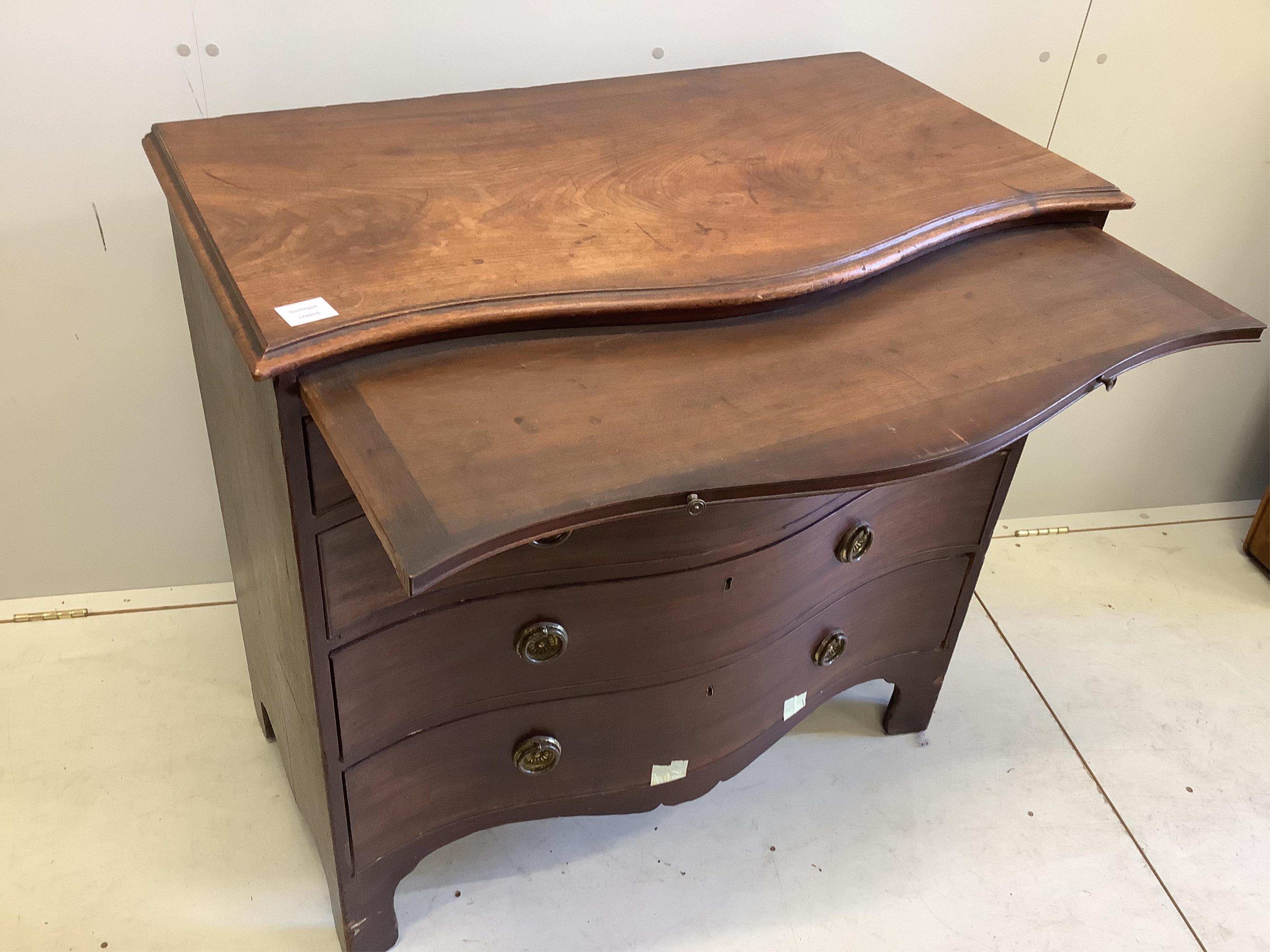 A George III mahogany serpentine chest with brushing slide, width 95cm, depth 52cm, height 91cm